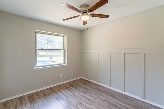 unfurnished room featuring wood-type flooring and ceiling fan