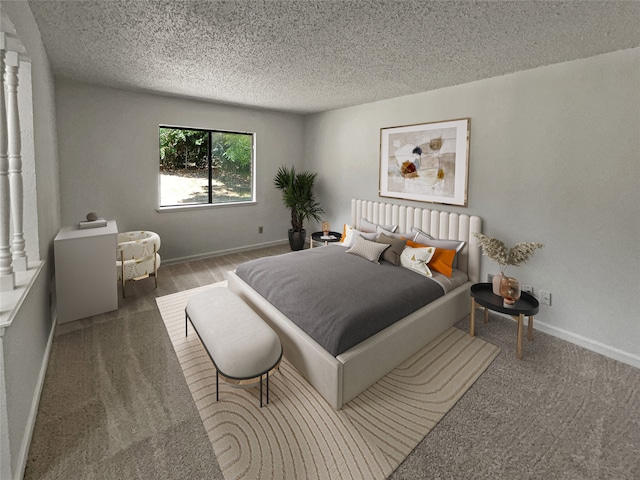 bedroom with carpet floors, ornate columns, and a textured ceiling