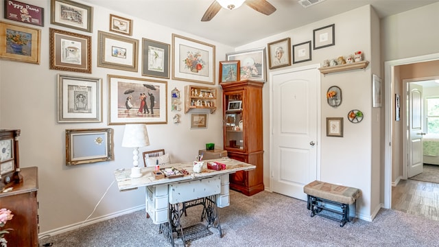 office featuring hardwood / wood-style flooring and ceiling fan