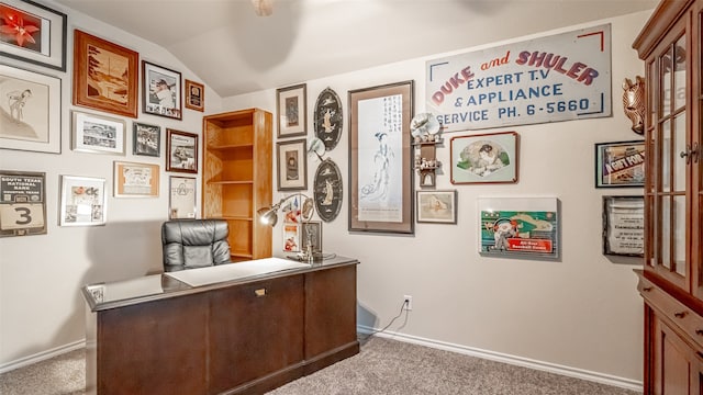 carpeted office space with lofted ceiling