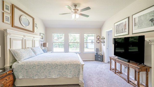 bedroom featuring ceiling fan, lofted ceiling, and carpet flooring