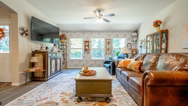 living room with ceiling fan, lofted ceiling, hardwood / wood-style floors, and a healthy amount of sunlight