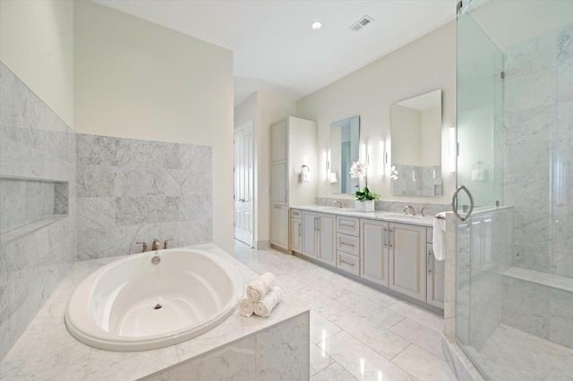 bathroom featuring vanity and shower with separate bathtub