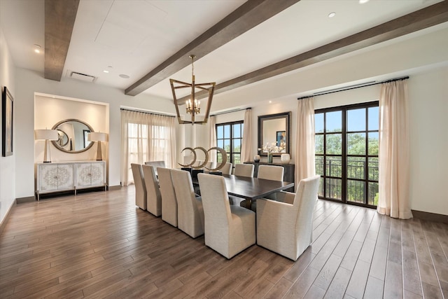 dining area with beamed ceiling, dark wood-type flooring, and an inviting chandelier