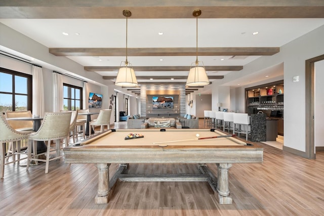 rec room with hardwood / wood-style floors, billiards, beamed ceiling, and bar area