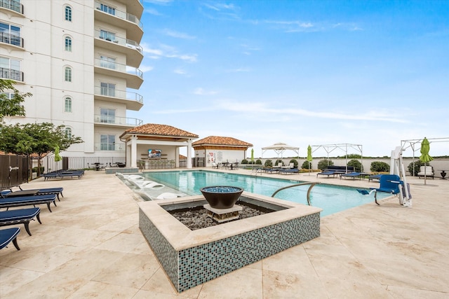 view of swimming pool featuring a gazebo and a patio area