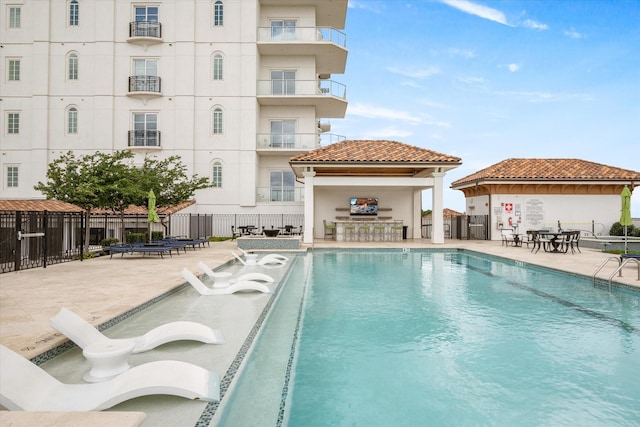 view of swimming pool with a patio