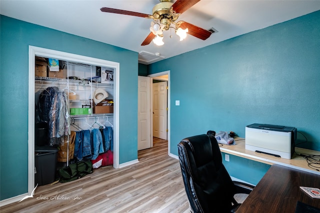 home office featuring wood-type flooring and ceiling fan