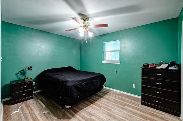 bedroom featuring light wood-type flooring and ceiling fan