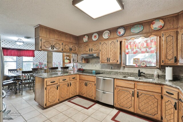 kitchen with sink, light tile patterned floors, kitchen peninsula, and ventilation hood