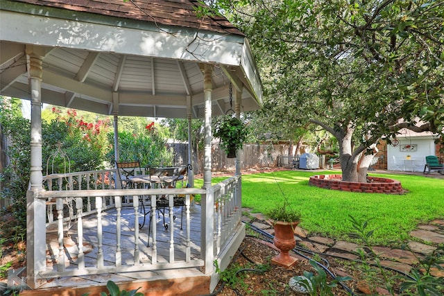 view of yard featuring a deck and a gazebo