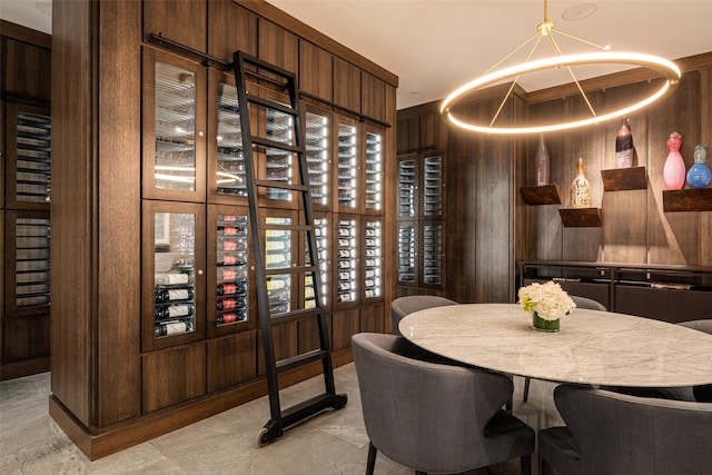 wine room with wooden walls and light tile patterned flooring