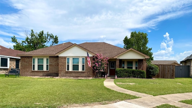 single story home featuring a front lawn