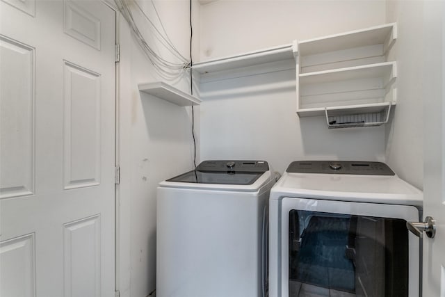 laundry room with washer and clothes dryer