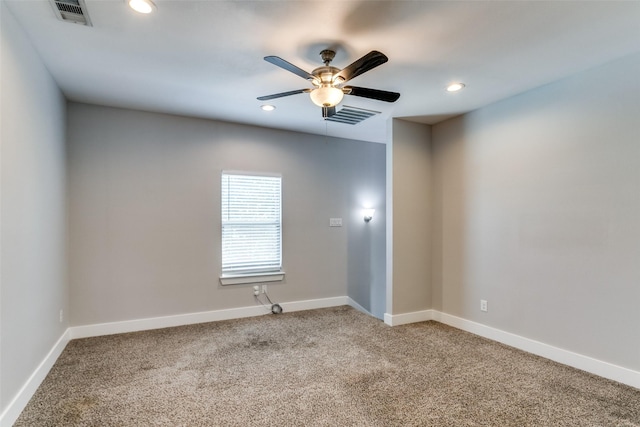 empty room with carpet flooring and ceiling fan