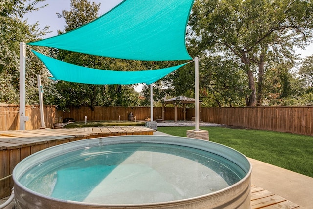 view of pool with a gazebo and a lawn