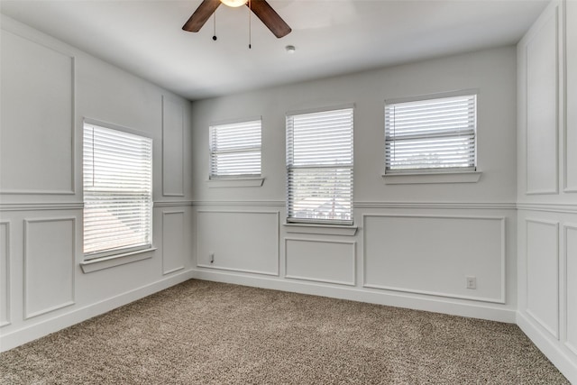 carpeted empty room with ceiling fan