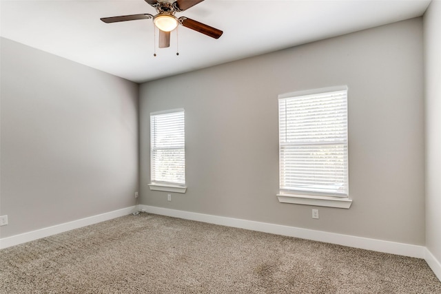 carpeted empty room with ceiling fan