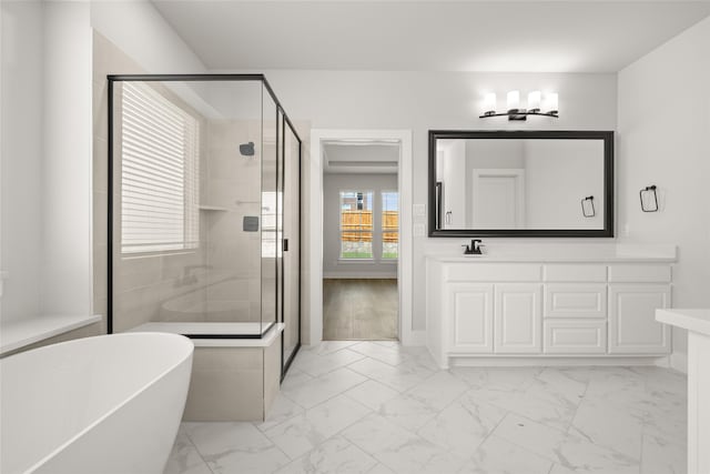 bathroom featuring shower with separate bathtub, hardwood / wood-style floors, and vanity