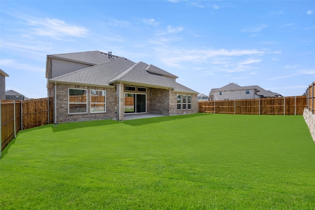 exterior space featuring a lawn and a patio