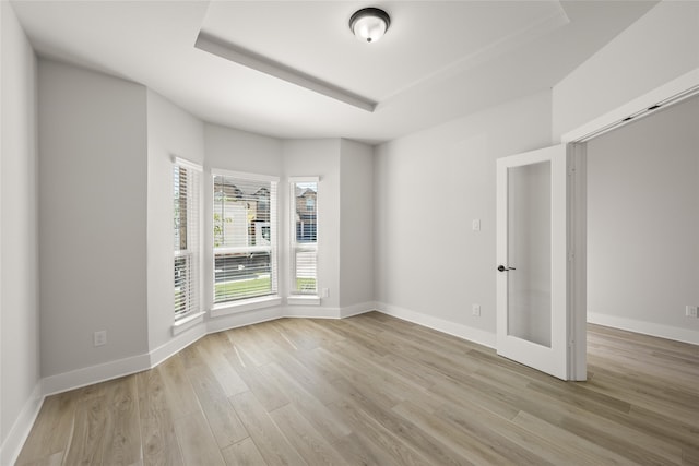 unfurnished room featuring light hardwood / wood-style floors