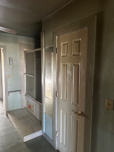 bathroom with tile patterned floors