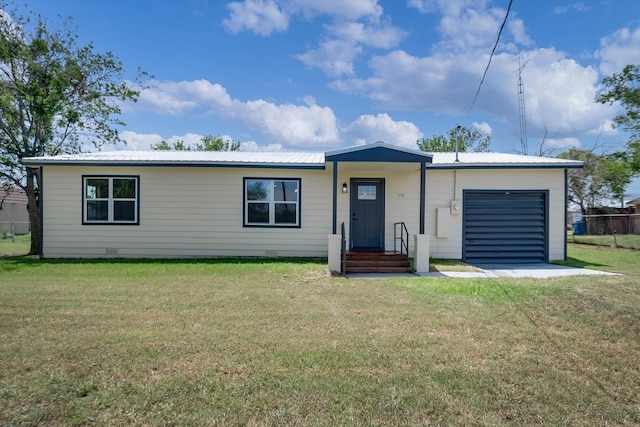 single story home with a garage and a front yard