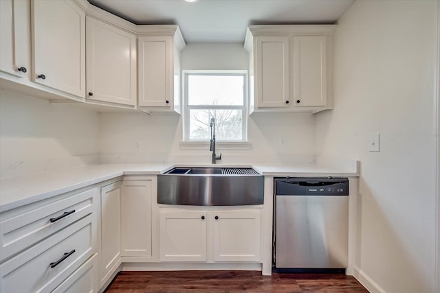 kitchen featuring sink, dishwasher, dark hardwood / wood-style floors, and white cabinets