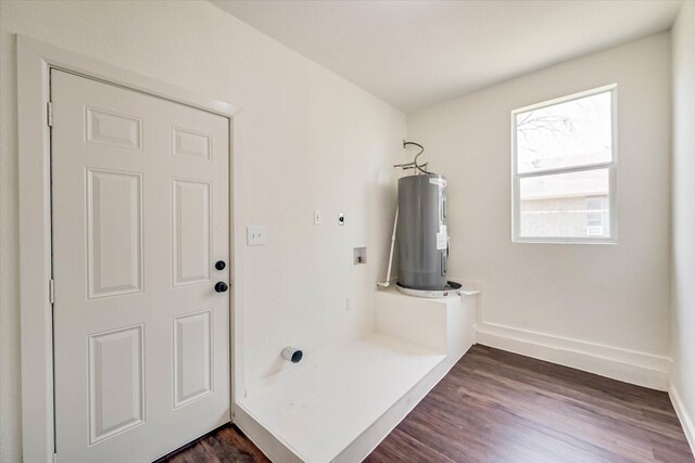 bathroom with electric water heater and hardwood / wood-style floors