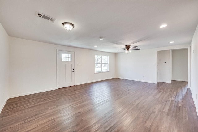 foyer entrance with wood-type flooring and ceiling fan