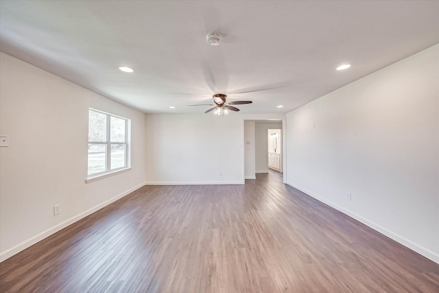 unfurnished room with wood-type flooring and ceiling fan