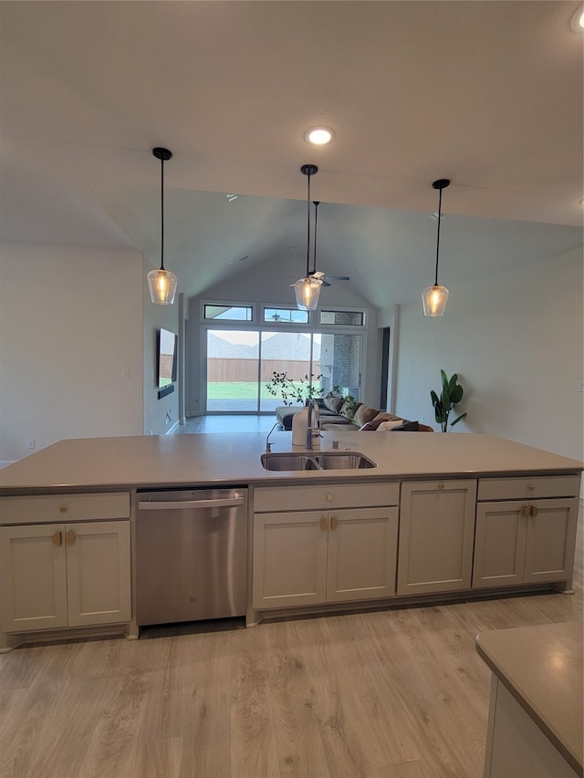 kitchen with sink, hanging light fixtures, light hardwood / wood-style flooring, and dishwasher