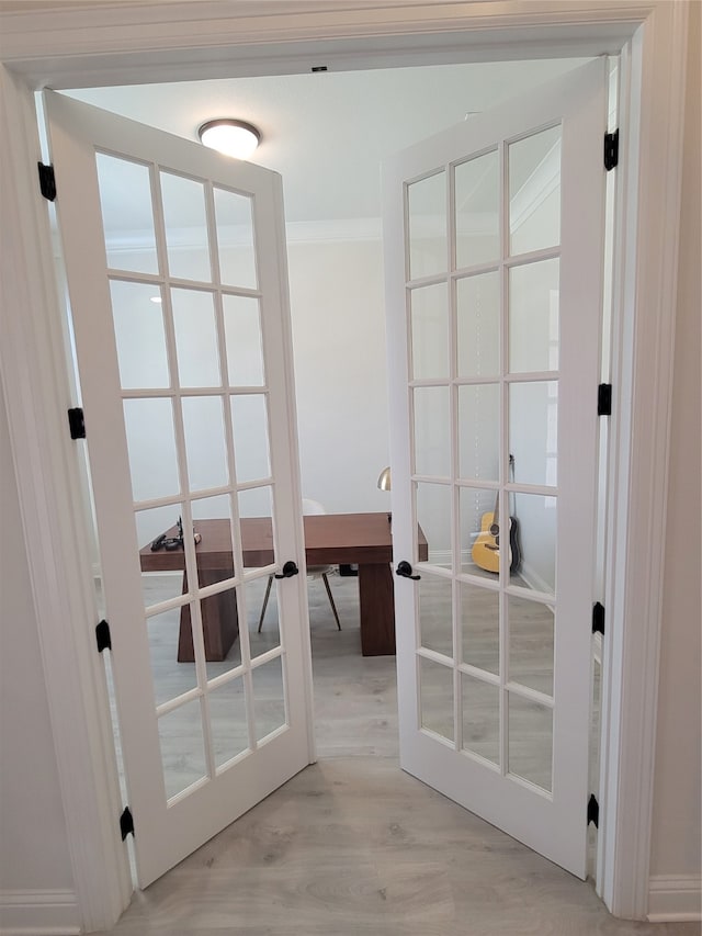 doorway to outside featuring light wood-type flooring and french doors