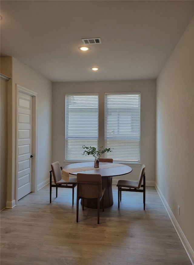 dining area with light wood-type flooring