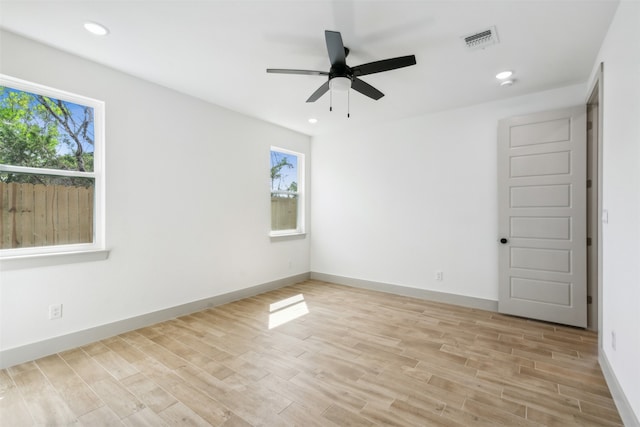 empty room featuring light wood-type flooring and ceiling fan