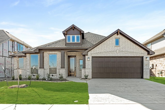 view of front facade with a garage and a front yard