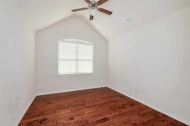 spare room with ceiling fan, wood-type flooring, and vaulted ceiling