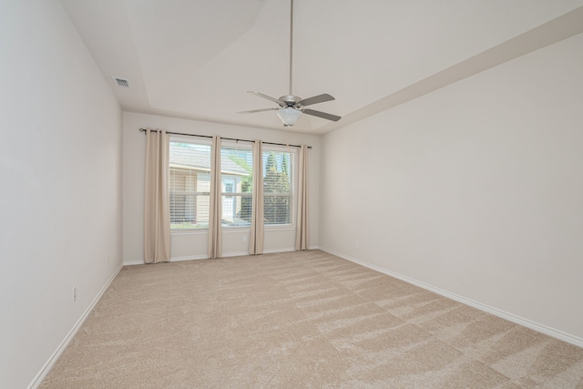 unfurnished room featuring light colored carpet and ceiling fan