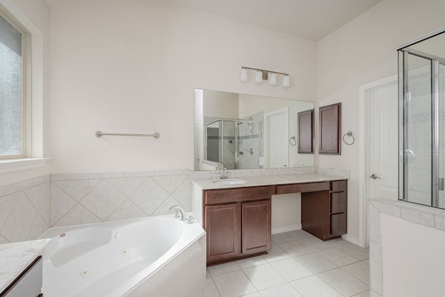 bathroom with tile patterned floors, plus walk in shower, and vanity