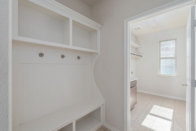 mudroom with light tile patterned flooring