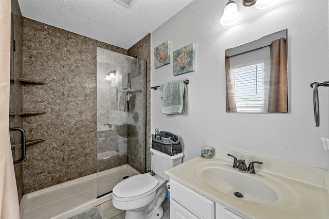 bathroom featuring an enclosed shower, a textured ceiling, toilet, vanity, and tile patterned floors