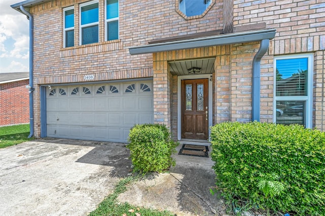 view of exterior entry with a garage