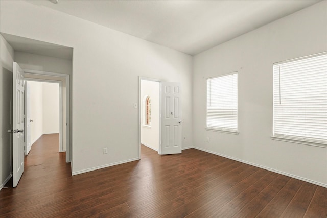 unfurnished room with dark hardwood / wood-style floors