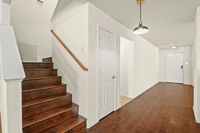 staircase featuring hardwood / wood-style flooring