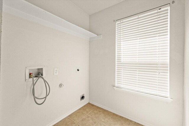 laundry area featuring hookup for a gas dryer, light tile patterned flooring, hookup for a washing machine, and electric dryer hookup