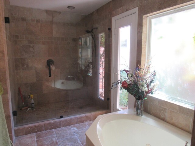 full bath with a garden tub and a stall shower