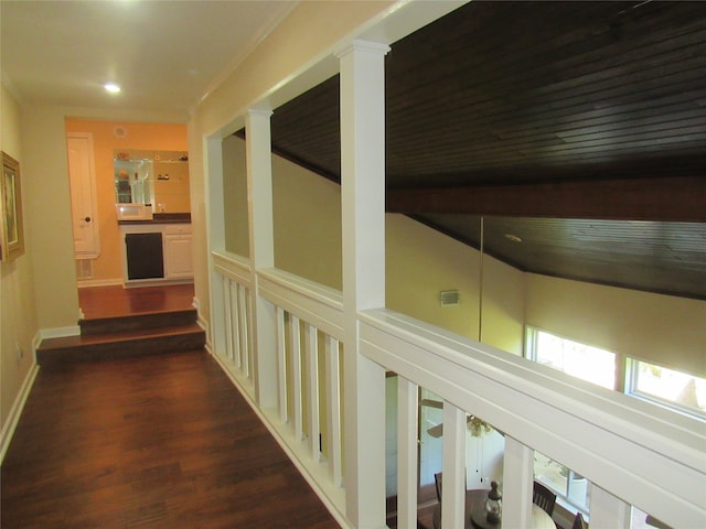 hallway with dark hardwood / wood-style flooring