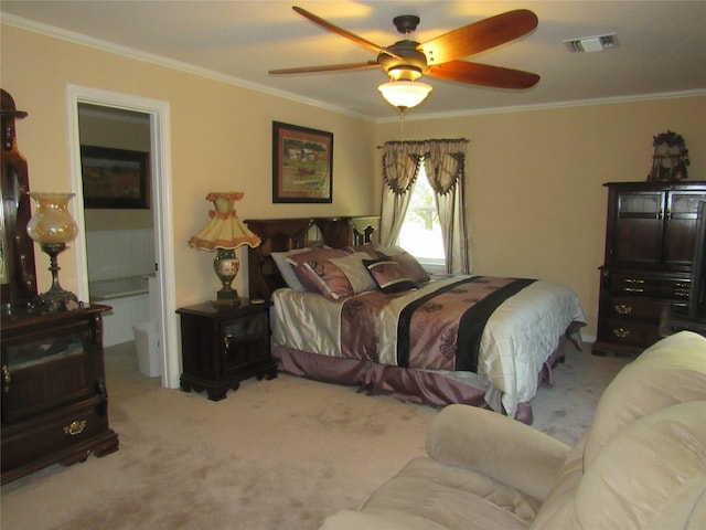 carpeted bedroom featuring ceiling fan and crown molding