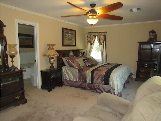 carpeted bedroom featuring ceiling fan, visible vents, and crown molding