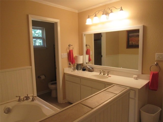 full bath featuring wainscoting, crown molding, vanity, and toilet